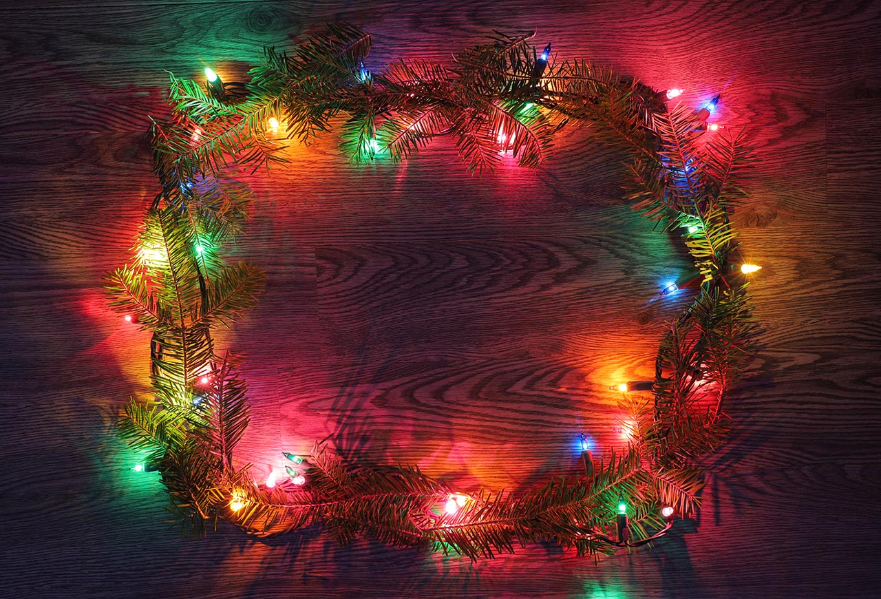 Christmas Lights Frame with Branches on Wood